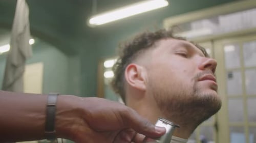 Man Gets Haircut in Barber Shop