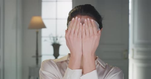 Beauty shot of young woman wearing paper sheet facial mask ready for moisturizing anti wrinkle day