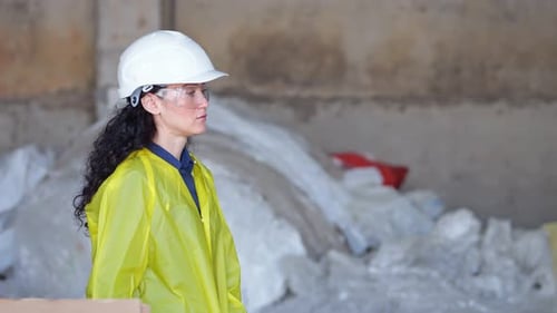 Professional Supervisor Controls Work at Waste Sorting Plant