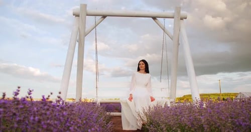 Woman on Swing in a Lavender Field