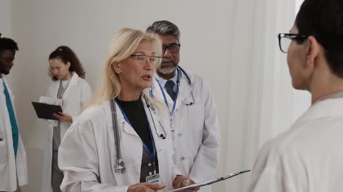 Medical Professionals Team Meeting in Hospital Setting