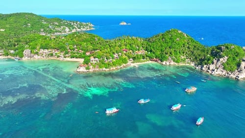 Drone aerial view over tropical coast and stunning island.
