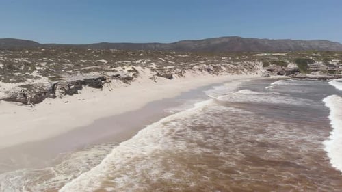 AERIAL: Beautiful Coastline with lovely Beach next to South African Garden Route