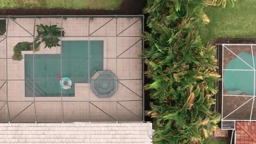 Aerial Above View of Screened in Pool and Lanai in Florida House Top Down Aerial Shot