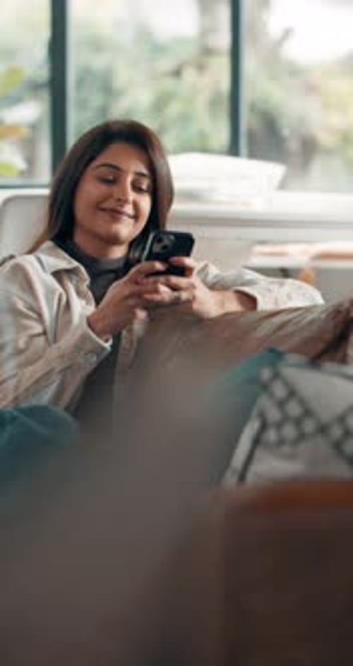 Happy, home and woman on sofa, smartphone and message to contact, internet and texting