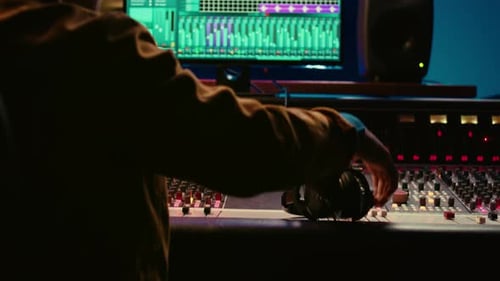 Music Producer Mixing Sound in Recording Studio