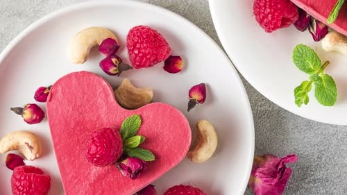 Valentines Day Dessert Heart Shaped Raw Vegan Red Cakes with Raspberries Dried Rose Flowers and Mint