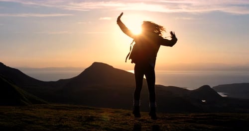 4k video footage of an unrecognizable woman enjoying the mountain views during her hike