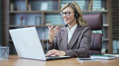 Woman with Laptop Video Conference at Office Desk