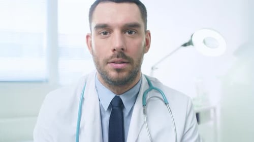 Concerned Doctor Explaining Diagnosis in Hospital Setting