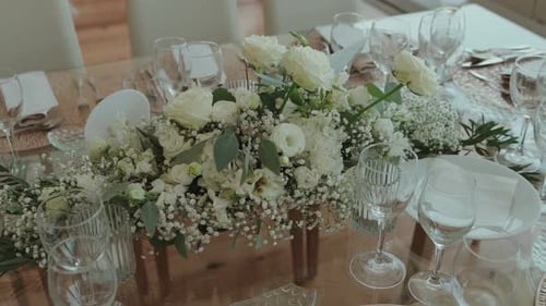 Elegant White Floral Arrangement on Wedding Table