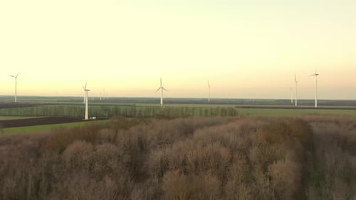 Aerial View of Powerful Wind Turbine Farm for Energy Production on Beautiful Cloudy Sky at Highland