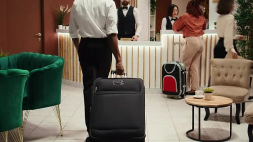 Guests Checking in to Hotel Lobby