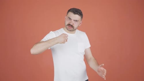 Man Threatening Violence with Fists and Gestures