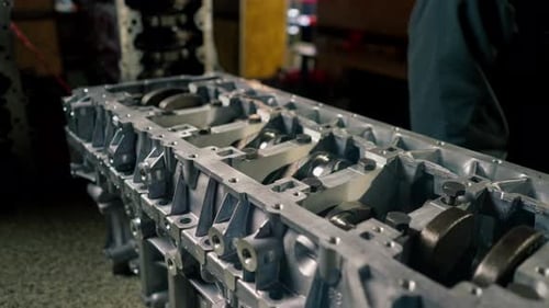 Close Up The Crankshaft Set of Pistons Closeup on Desktop of an Auto Mechanic Spare Parts of the Car