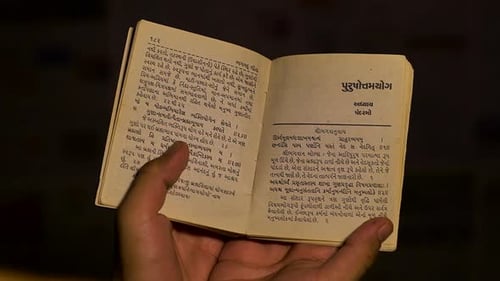 Man reading bhagwat geeta also called Bhagavad Gita