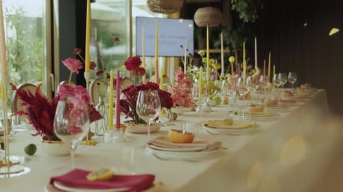 Festive Wedding Table Setting with Flowers and Candles