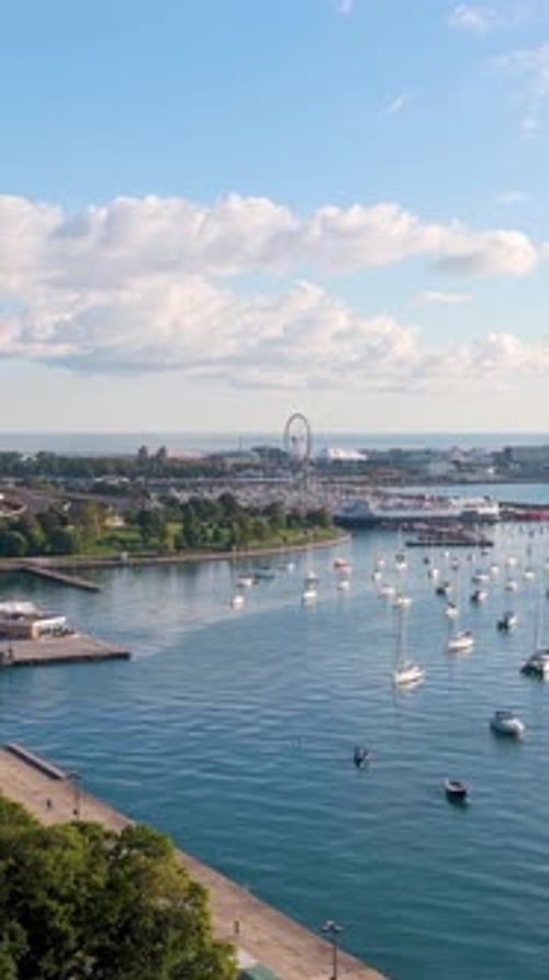 Aerial portrait shot over boats at the DuSable Harbor, sunny, fall day in Chicago