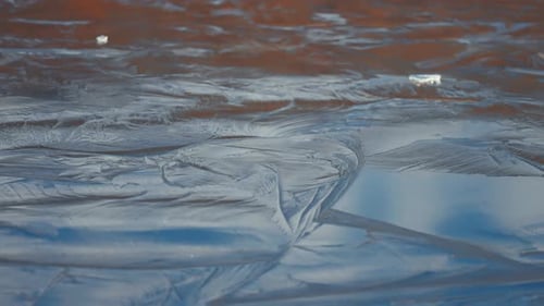Beautiful pattern on the surface of the frozen pond.parallax video.
