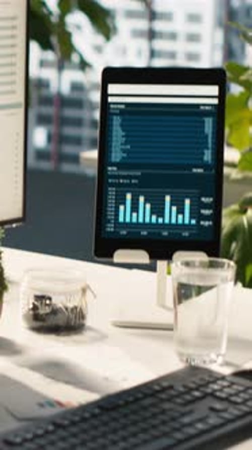 Vertical Video Modern Workspace with Analytical Data Dashboards Displayed on Devices