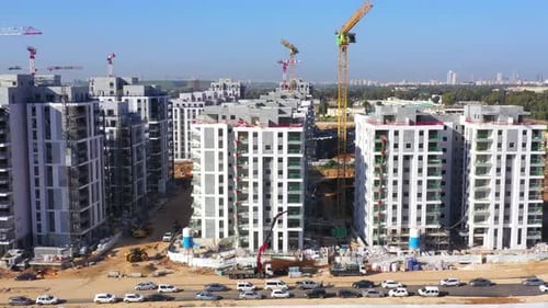 Residential Construction site with Cranes and building in progress, Aerial view.