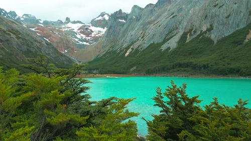 Aerial View on Emerald Lake in the Andes Mountain Forest in Rainy Day Chile