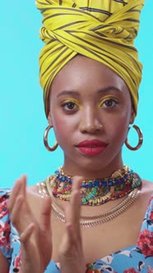 A Vibrant Portrait Depicting a Young Woman Wearing Colorful Attire and a Beautiful Headwrap