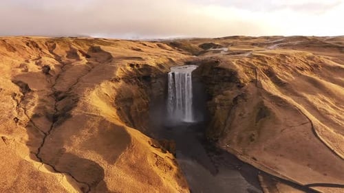 Skógafoss Waterfall Aerial View Over Iceland’s Golden Hills and Skógá River