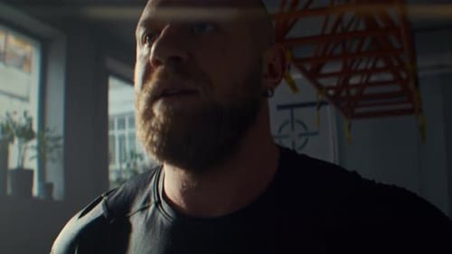Bearded Sportsman Breathes Heavily After Cardio Exercises Set