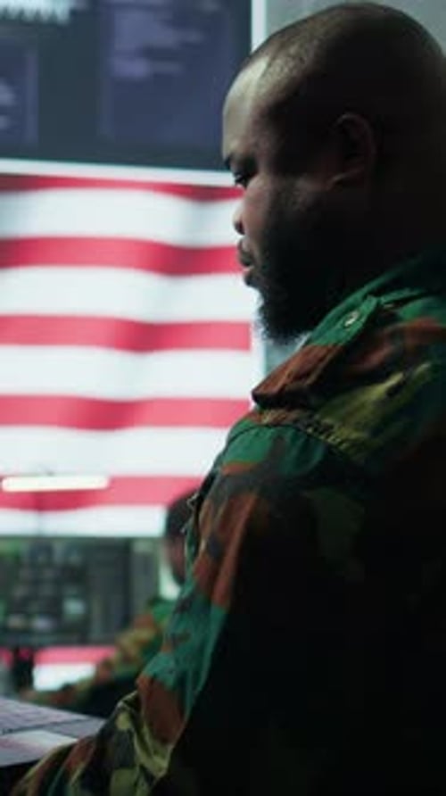 Vertical Video Intelligence Officers in American Military Uniforms Work in Command Post