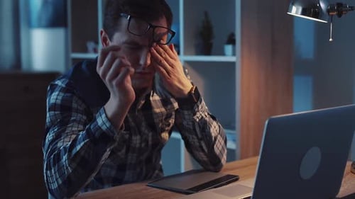 A Fatigued Student is Burning the Midnight Oil Striving Hard to Finish Assignments Late at Night