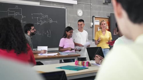 Team of Teenager Students Presenting Group Technology Project to Classmates and Teacher in College