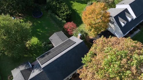 Aerial View of Suburban Home with Solar Panels
