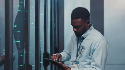 People working on Servers with Tablet and Laptop