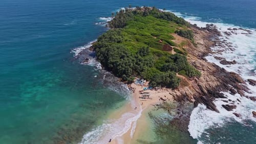 Drone zooming down on Blue beach island in Sri Lanka