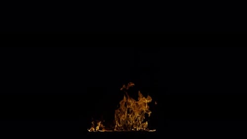 Ignite Collection: Small fire waves ejected swiftly from a ground fire on dark background shot up cl