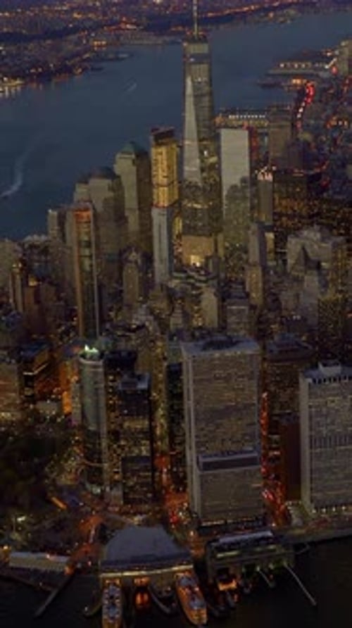 A Beautiful Aerial View of Manhattan at Night Displaying the Dazzling City Lights