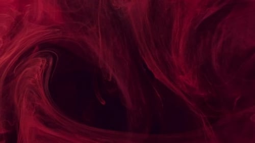 Deep Red Ink Swirls on Dark Background