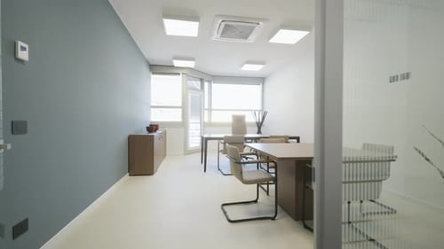 Bright modern office interior with furnished workspace, meeting table and chairs. Minimal corporate