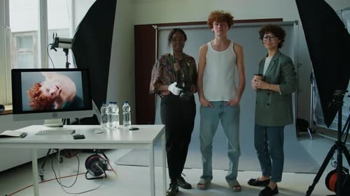 Group Portrait of Production Team in Photo Studio