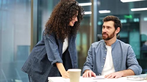 Business People Working Together in Modern Office Discussing Documents and Planning Strategy