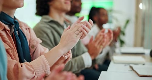 Group of Adults Clapping at a Meeting
