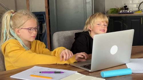 Online School Class Siblings Pupils Boy and Girl Learning Together Remotely Online at Home Looking