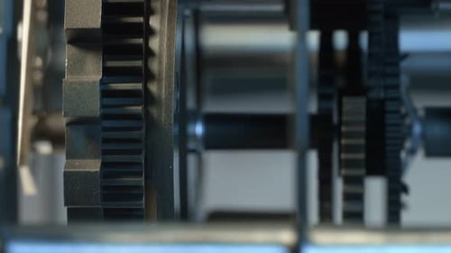 Gray Gears Turning in Automated Machine Close Up