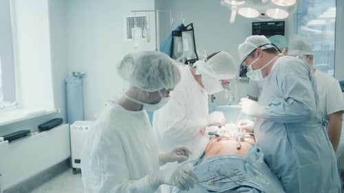 Surgical Team Performing Operation in Hospital Operating Room