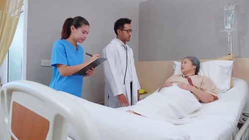 Specialist doctor man and nurse explaining and check with elderly patient in hospital.