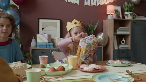 Children Celebrate a Birthday at Home Indoors