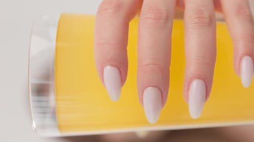 Various Drinks in Clear Glasses Held by Hands