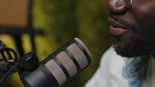 Close Up View of Podcaster Speaking into Microphone