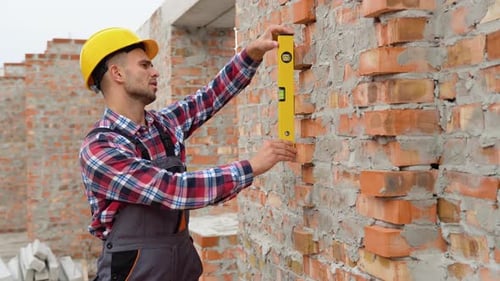 Worker Control Brick Wall Using Level Tool